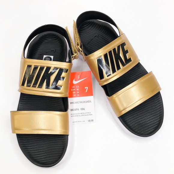 nike gold and black slides